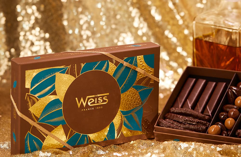 Un coffret de chocolat garni de spécialités Weiss pour les 140 ans